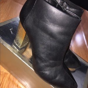 Black booties with gold heel